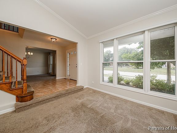 2 story foyer gives an open airy feel.