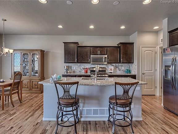 The wood flooring continues throughout the main floor.