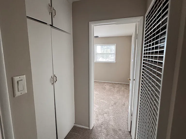 Hallway and first bedroom entrance