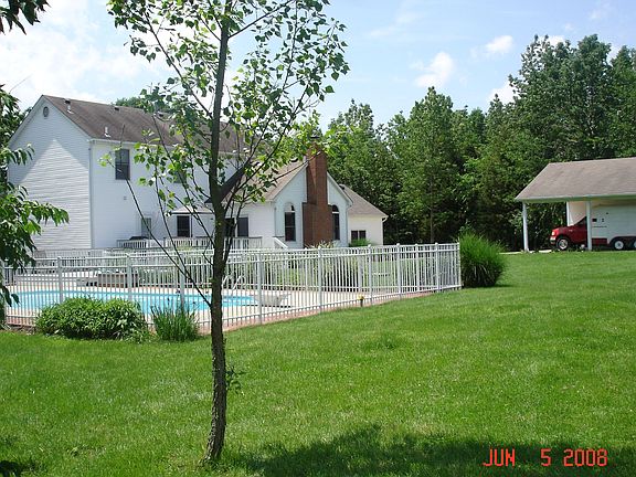 back yard with pool, 2 tier deck and carport