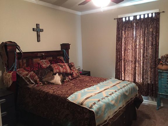 Representative Bedroom, bed and curtains left with tenant