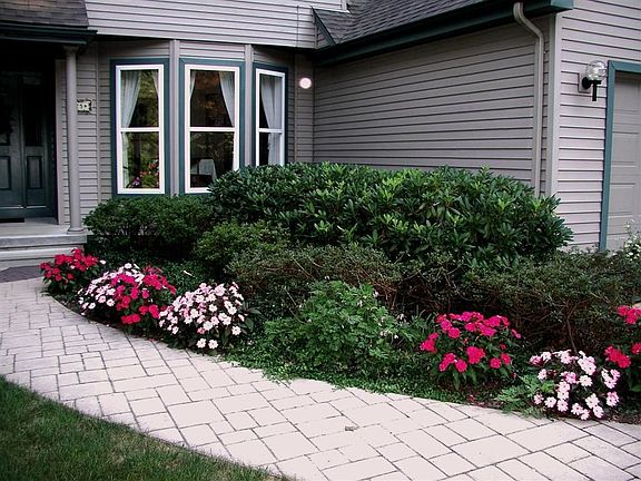 Professional landscaping and plant selection makes for a very appealing home