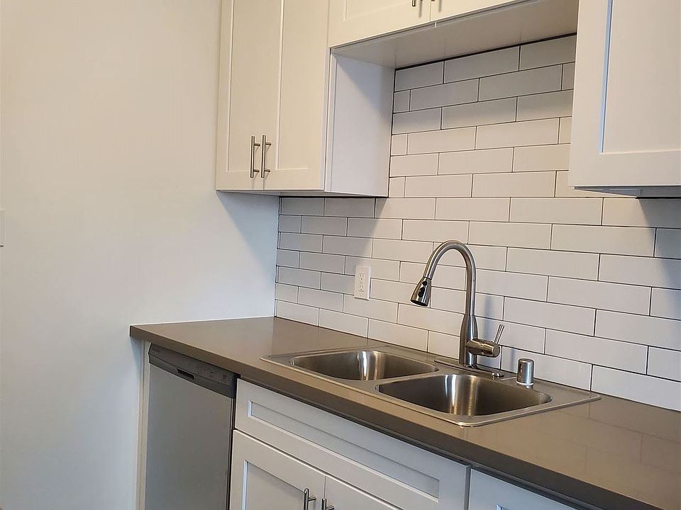 1217 A Kitchen with dishwasher and tile backsplash