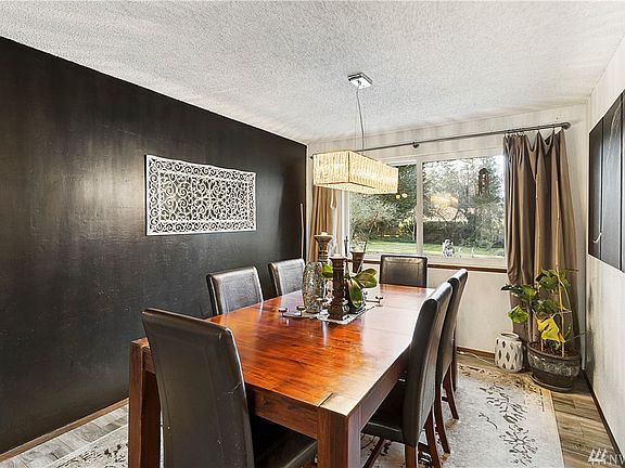 Dining room with updated lighting.