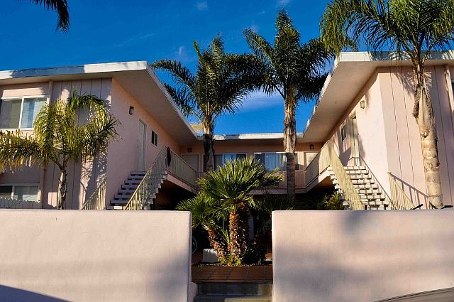 Front of building and courtyard. Unit 2 is in back left corner.