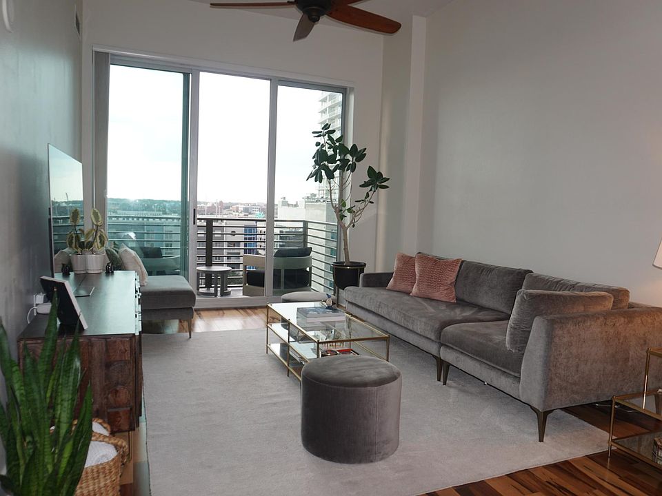 Enjoy high ceilings with a large open living area concept. Before remodel photo, left to show designer furnishings and scale.
