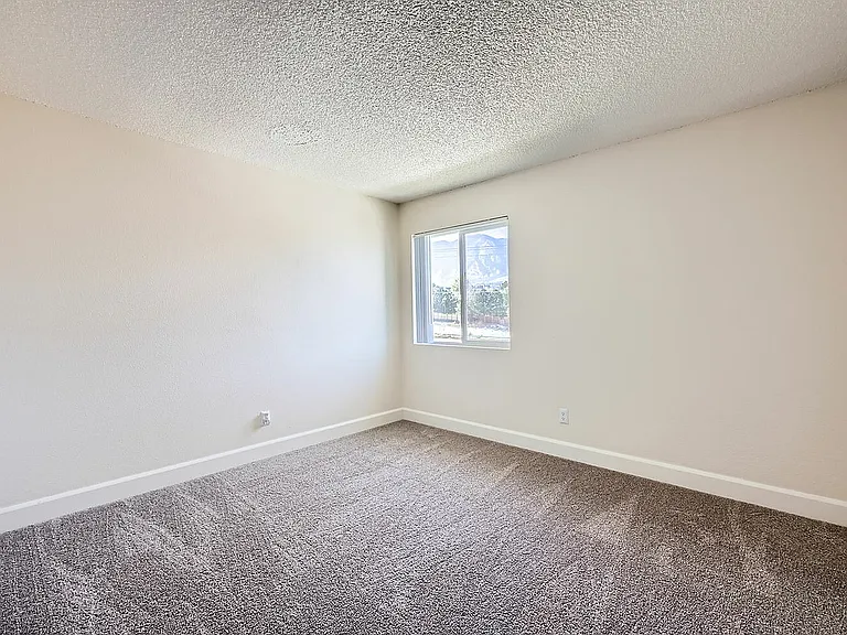 Experience comfort and tranquility in this bright and airy bedroom, perfect for relaxation.