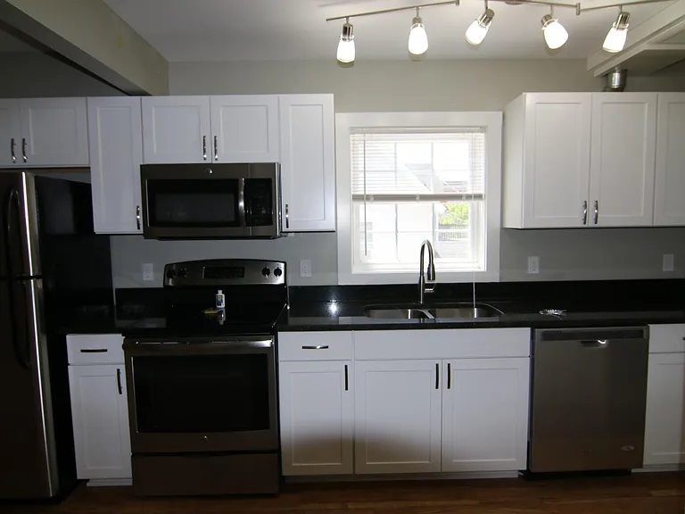 Kitchen, standing in the eating area looking at the kitchen.