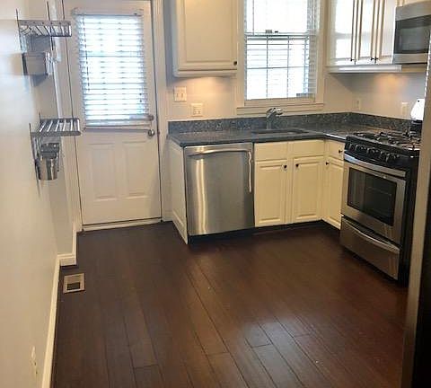 Kitchen contains door to back patio