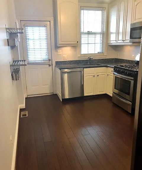 Kitchen contains door to back patio