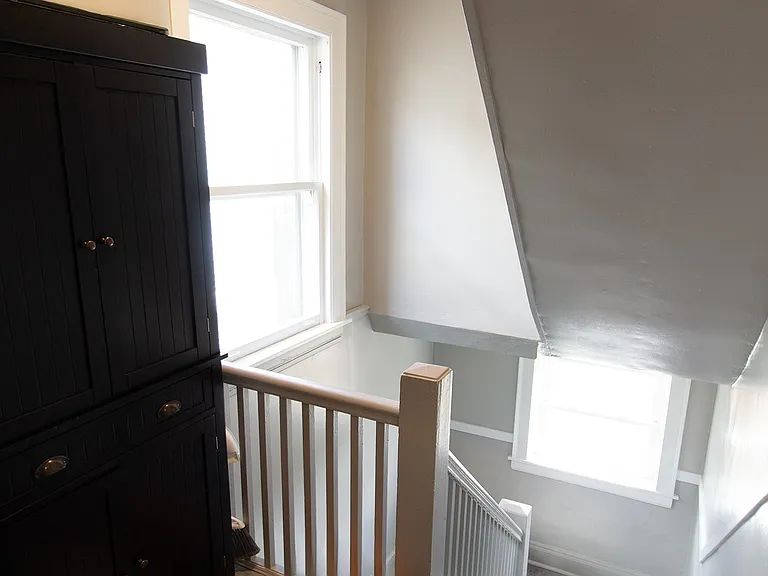 Rear steps from rear entrance of apartment. Pantry for additional food storage.