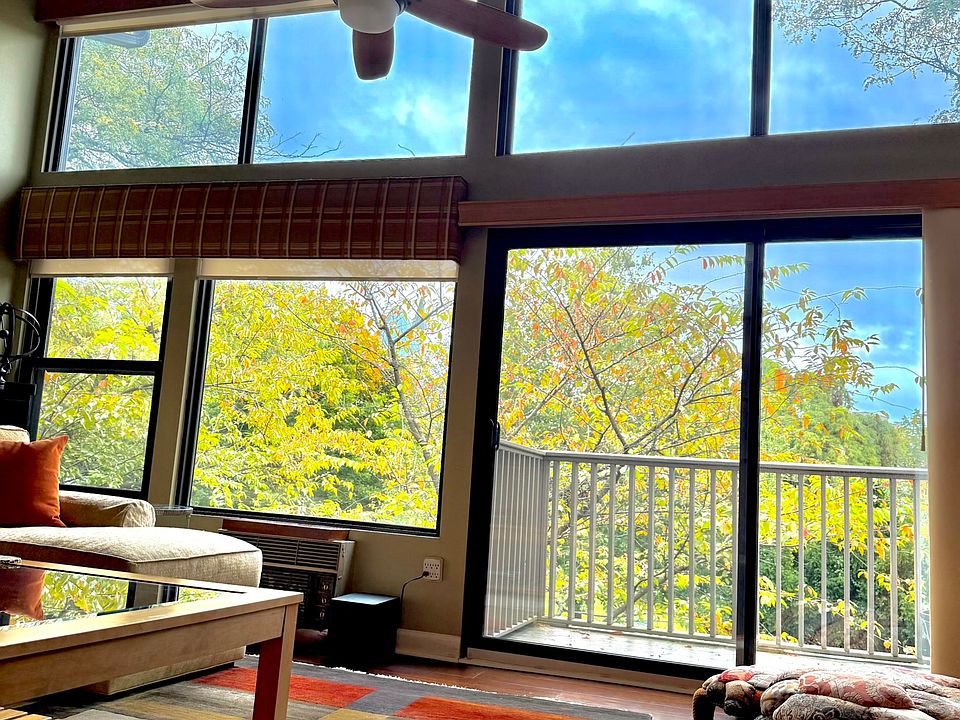 Living room has southern exposure, solar shades and ceiling fan