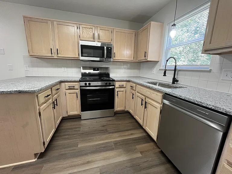 New appliances, counters, sink, lighting, and floors.