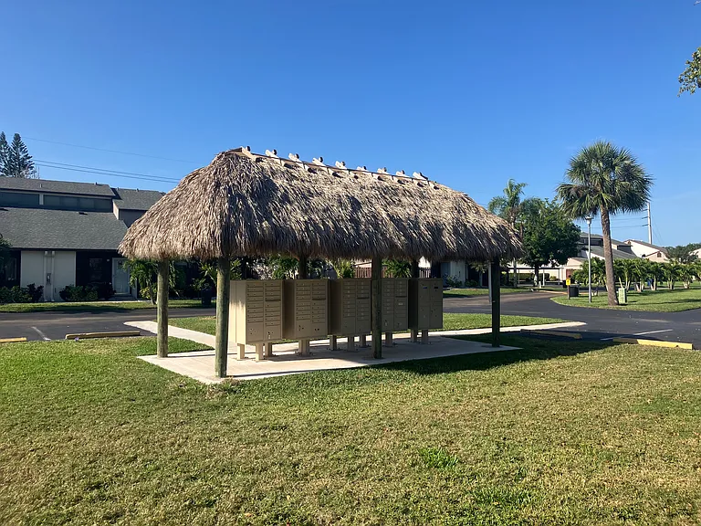 The mailboxes are conveniently located to the home.