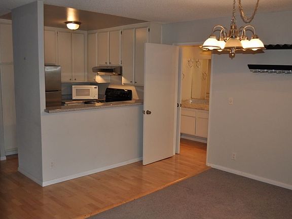 Dining Area and Kitchen with Stainless Steel Appliances
