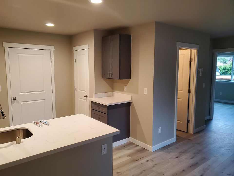 Bathroom on the right, kitchen on the left with pantry closet.
