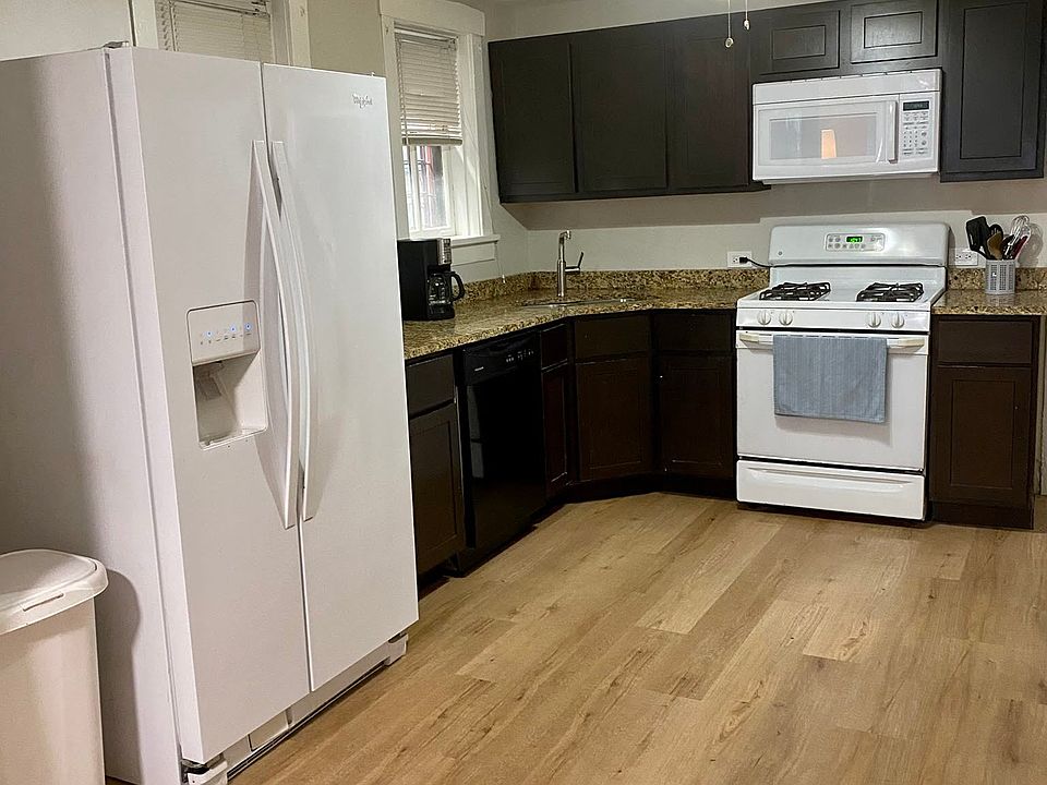 Kitchen stocked with cookware, glassware, utensils, etc.