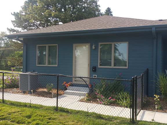 Private entrance, yard and lots of flowers.