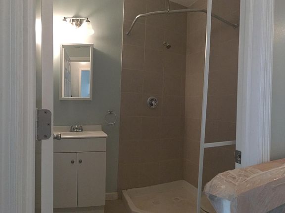 Bath with stand up shower