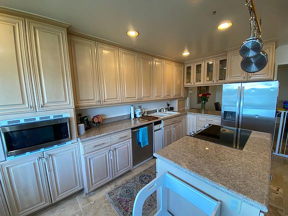 Kitchen with granite countertops and custom cabinets