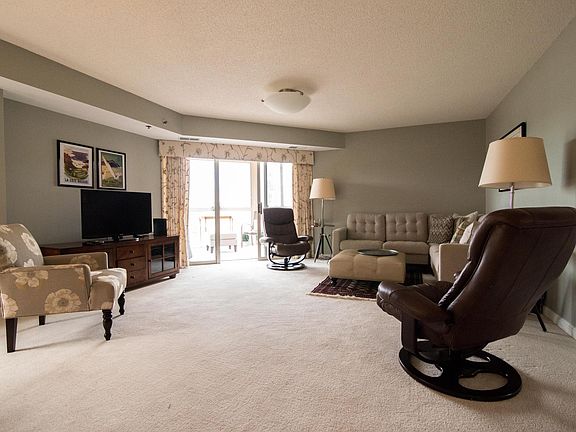 Huge living room. All pictured furniture is included with rental.