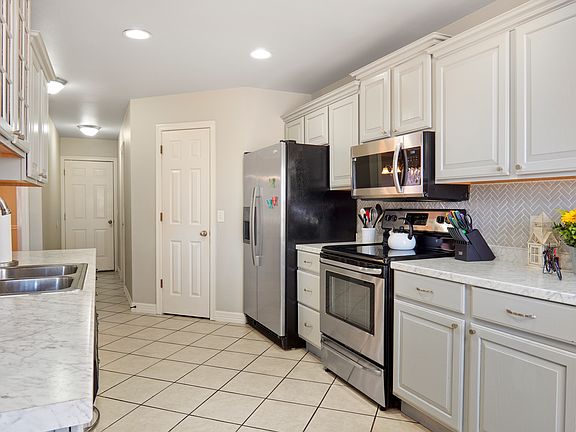 The kitchen is ready for you - just bring your own groceries! The door leads to an extra large pantry.