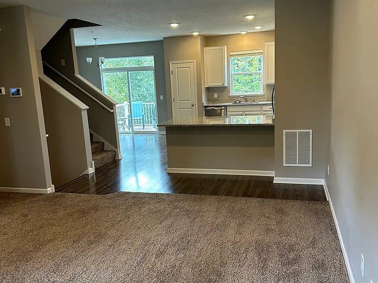 Family room looking into the kitchen. Space at the island for 3 bar stools.