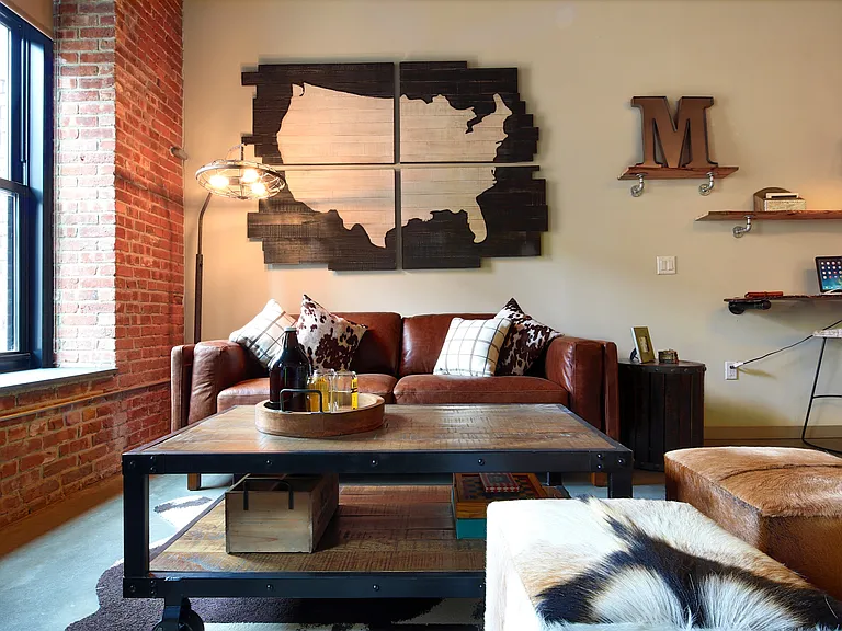 Enlarged Warehouse Windows with Roller Shades Allow for Plenty of Natural Light