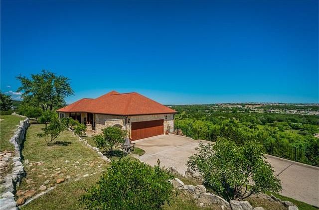 Home with a View in the Homestead!  City of Bee Cave!  Excellent Lake Travis Schools.  Wooded lot, low maintenance, acreage living!  4 bedrooms plus an office.