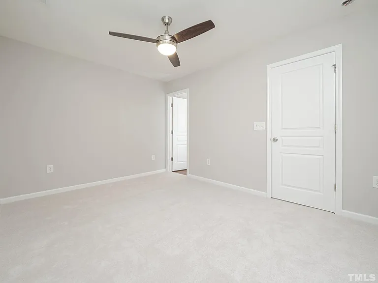 Angel of master bedroom showing bathroom door.