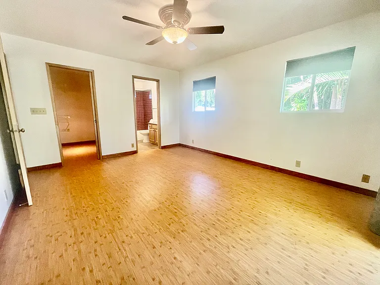 Master bedroom with walk-in closet, en-suite bathroom, and brand new flooring