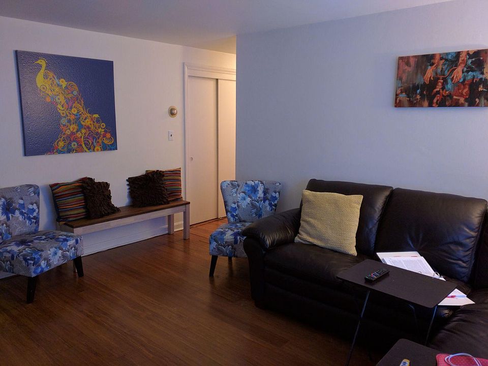 Part of the living room the wall with picture is the wall between living room and kitchen. The hall shown which brings you to the 3 bedrooms