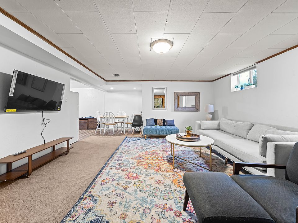 Large living/ dining area complete with smartTV, dining table for 4, and eat-in kitchen.
