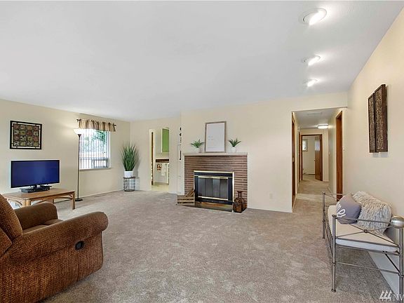 Walk into the large living room.  New carpet throughout.  Plus wood burning stove.