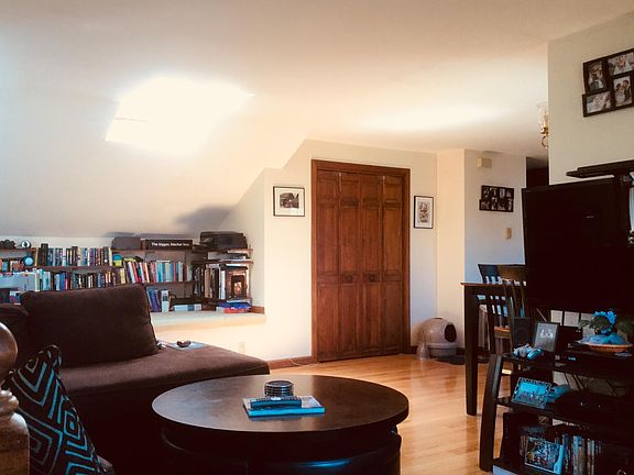 Large open LR/ dining/ kitchen w skylight and many large win