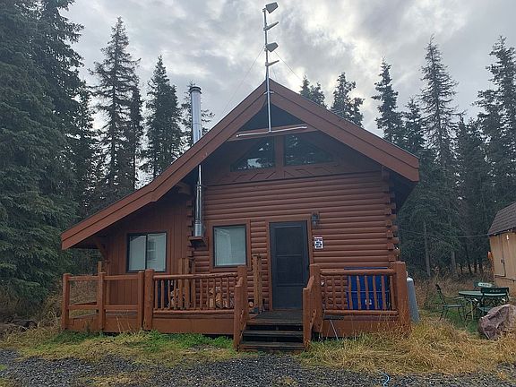 Cabins in spruce trees.