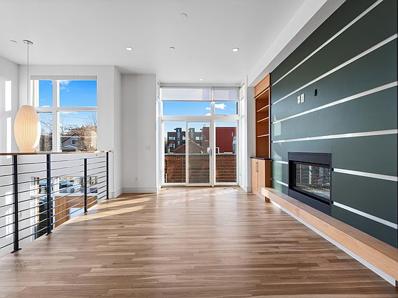 living area, fireplace, balcony