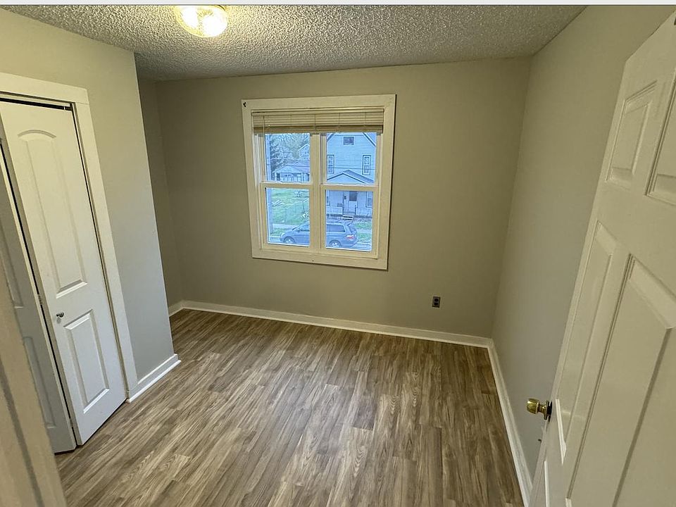 Front bedroom w/ new paint and flooring
