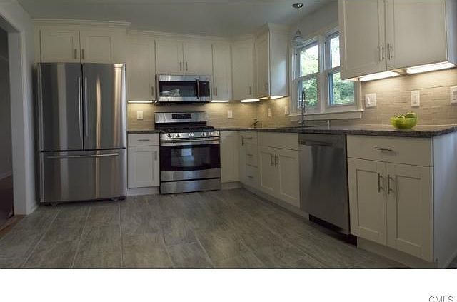 New granite counter tops, stainless steel appliances, high end cabinetry with soft close drawers and lazy susan to reach items easier.