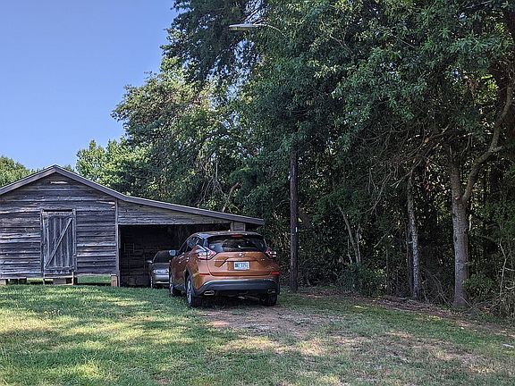 Detached workshop with parking