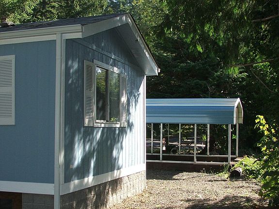 Side of home with New Carport