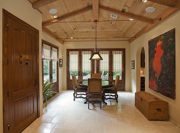 Formal dining with floor to ceiling French doors 