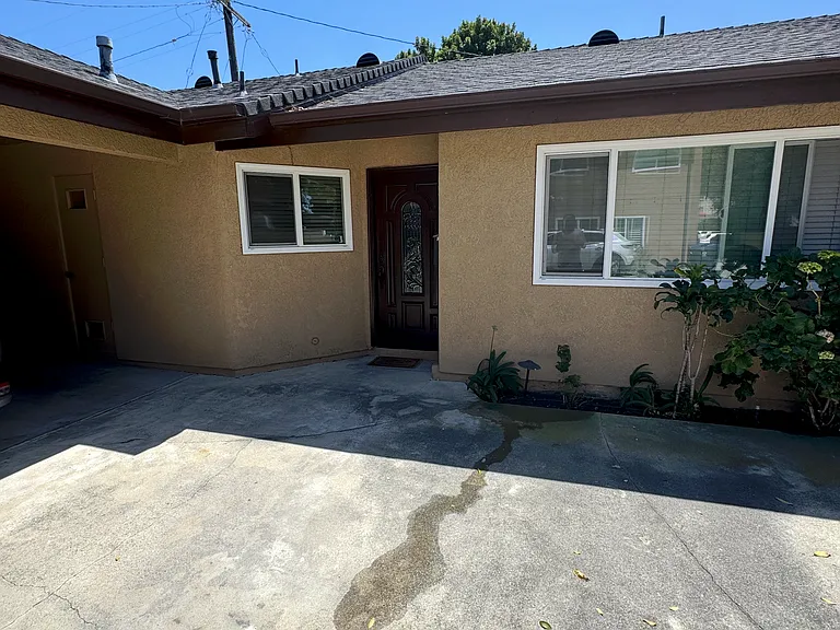 Front of the unit with convenient on-site parking, providing easy access and everyday functionality.
