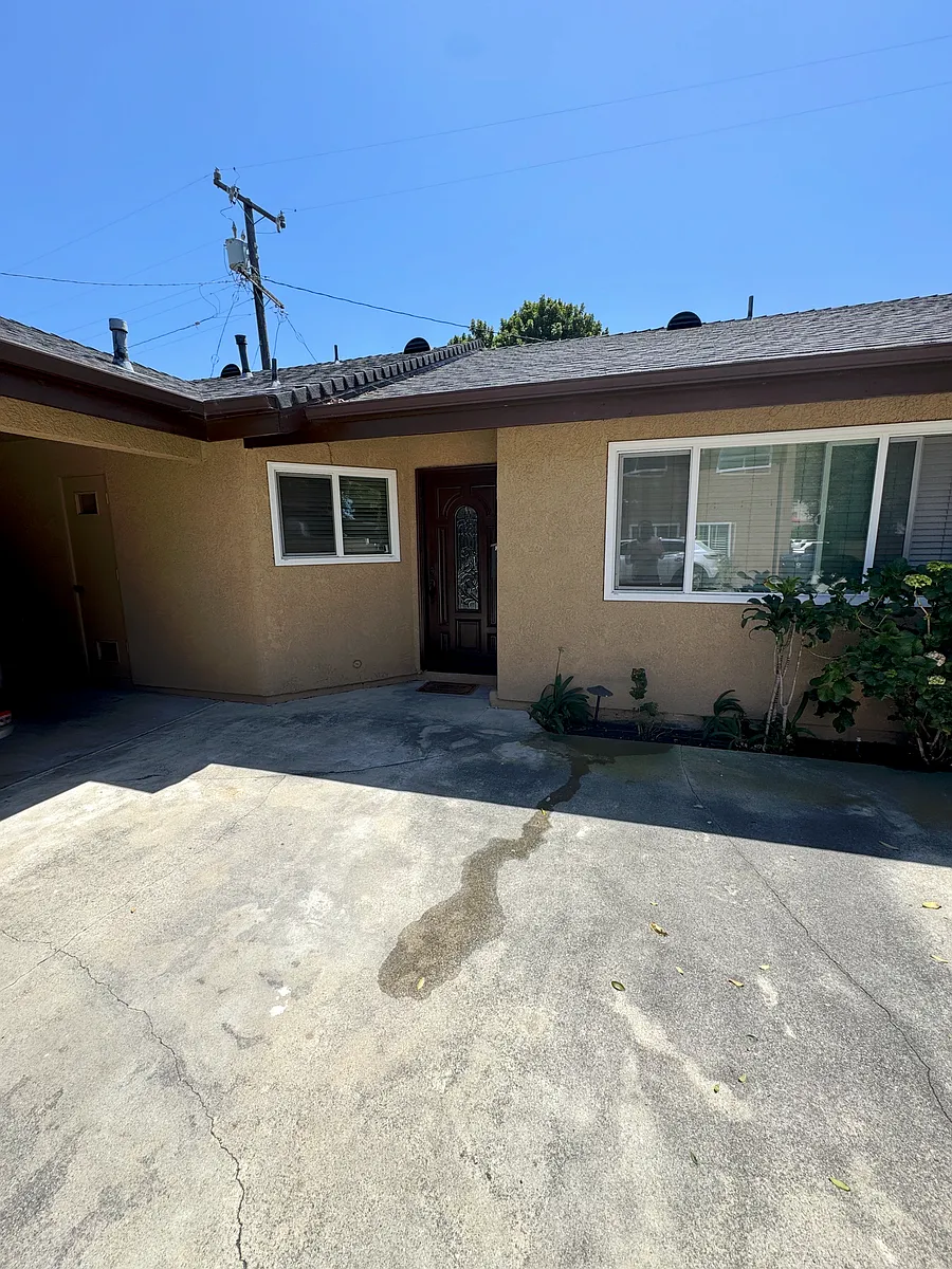 Front of the unit with convenient on-site parking, providing easy access and everyday functionality. - 4928 W 119th Pl #C