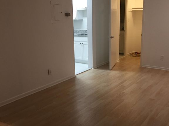 living area, entrance to kitchen, closet and bath