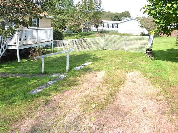 Off street parking.  Double gate opens for easy mowing access or additional parking
