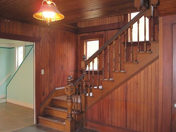 A view of the pretty, natural wood staircase.
