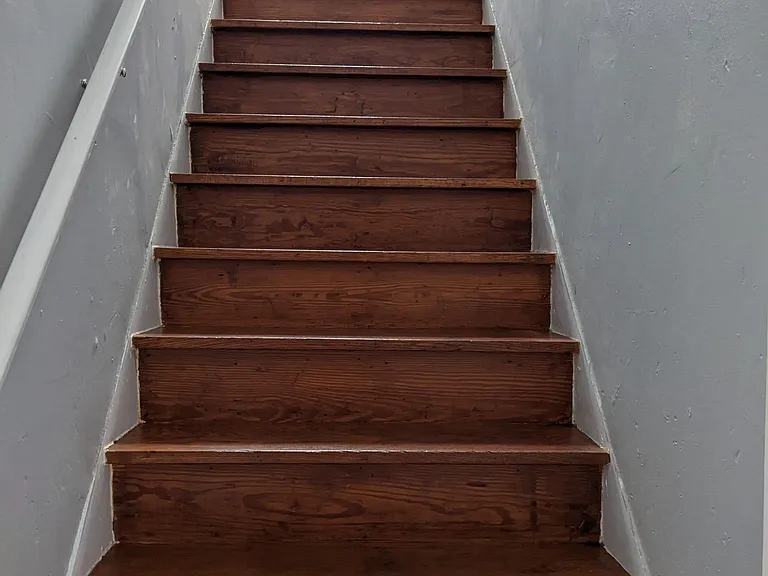 Standing at bottom of steps