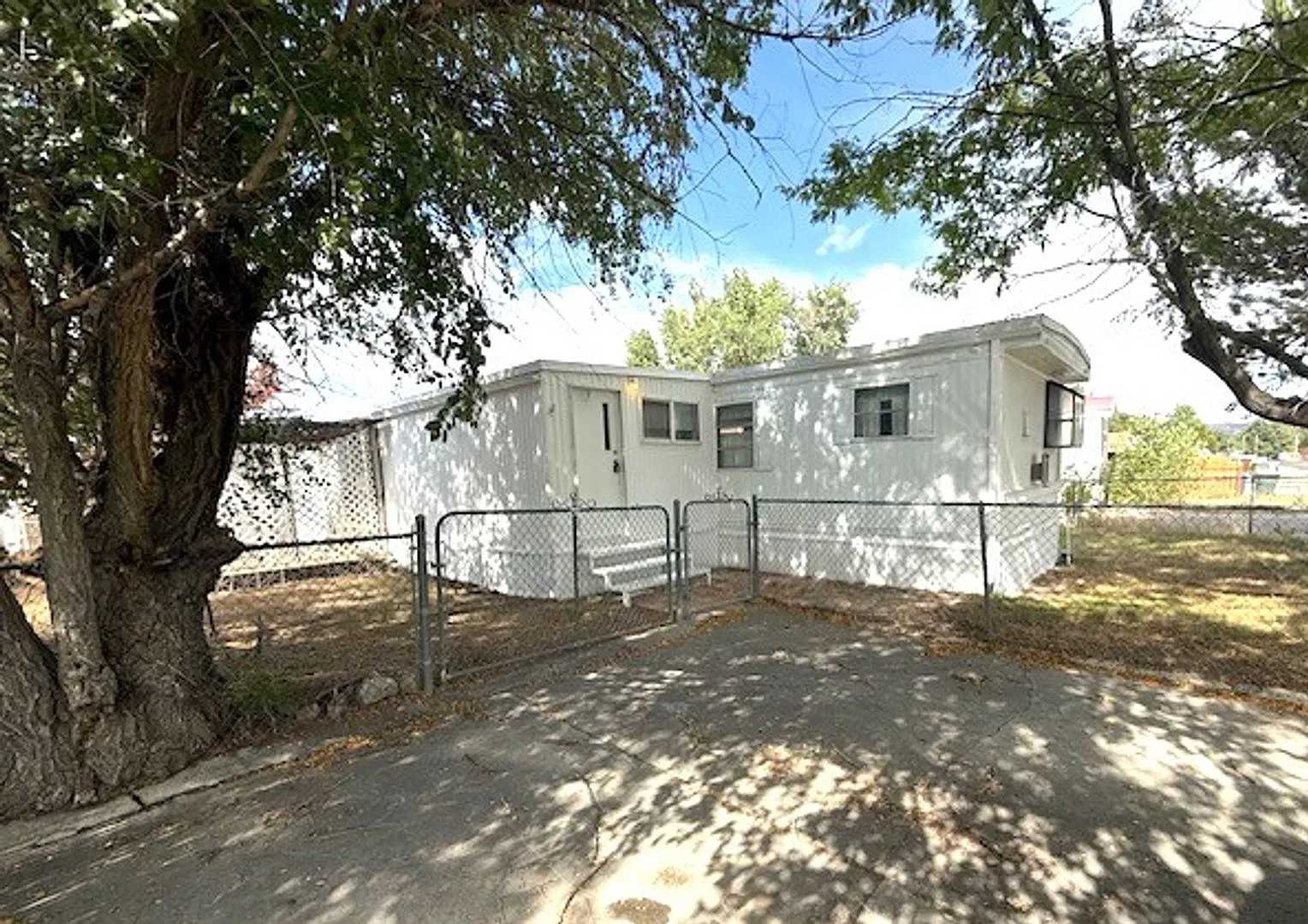 2 bedroom manufactured home in Elko with a fenced yard and large shed — Photo 1