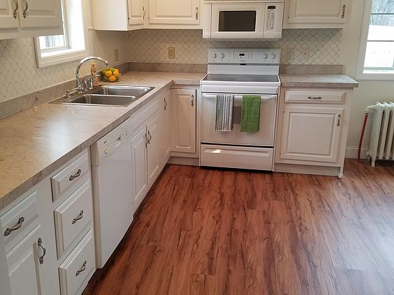 Large kitchen beautiful vinyl plank flooring throughout house.